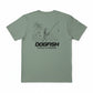 Green t-shirt with a graphic design and 'Dogfish Tackle & Marine' text on a white background