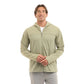 A man wearing a light sage green zip-up hooded jacket over a white t-shirt and gray pants, standing against a solid white background.