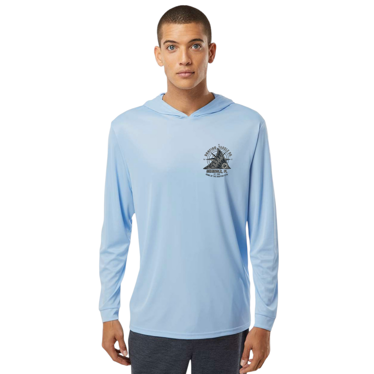 Dogfish Tackle & Marine light blue long sleeve performance hoodie with a black logo on the chest worn by a man