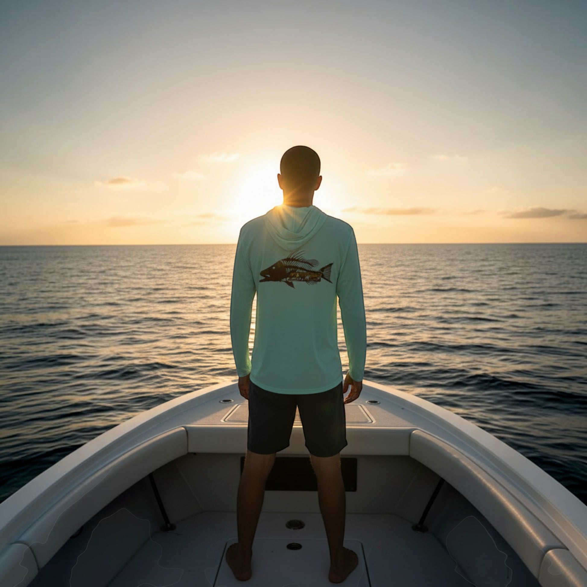 Dogfish Tackle & Marine light mint long sleeve hooded performance shirt with fish skeleton graphic on back.