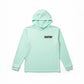 Mint green long-sleeve shirt with a logo on a mannequin against a white background