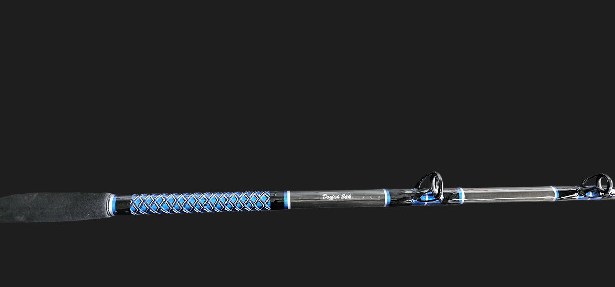 Up close picture of Dogfish Stik custom shark rod. showing a perfectly wrapped blue, silver and black butt wrap. you can also see Heavy Duty American Tackle Boat Guides 