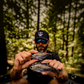 Dogfish Tackle & Marine angler holding two 6th Sense The Option swimbaits with realistic scales and dorsal fins