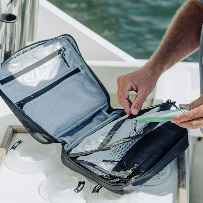 Dogfish Tackle & Marine AFTCO Utility Gear Bag, black, water-resistant material, multiple interior pockets and zippers for organizing fishing gear.