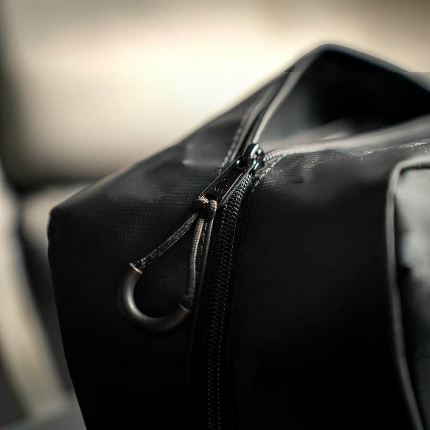 Dogfish Tackle & Marine 6th Sense Bait Binder featuring a durable black water-resistant exterior and heavy-duty zipper