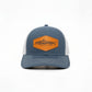 Dogfish Tackle & Marine blue trucker hat with white mesh back and leather patch featuring a tarpon logo.