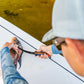 Dogfish Tackle & Marine Danco Lunar-I 7-inch micro flex fillet knife being used to clean a fish on a boat deck