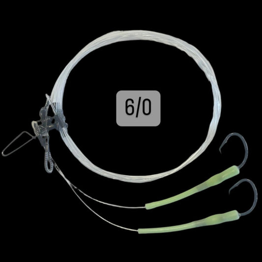 Dogfish Tackle & Marine deep drop fishing rig with 2 hooks, glow-in-the-dark sleeves, and 300lb monofilament line.