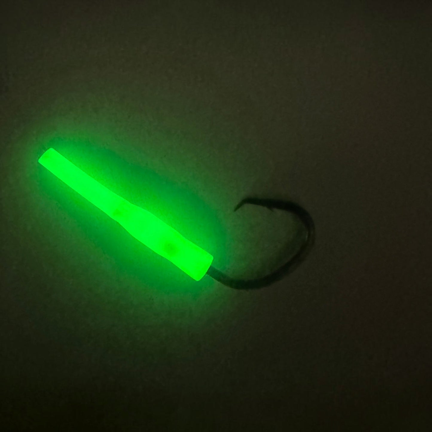 Dogfish Tackle & Marine deep drop fishing rig with a bright green glow-in-the-dark chafe protector and a black nickel circle hook.