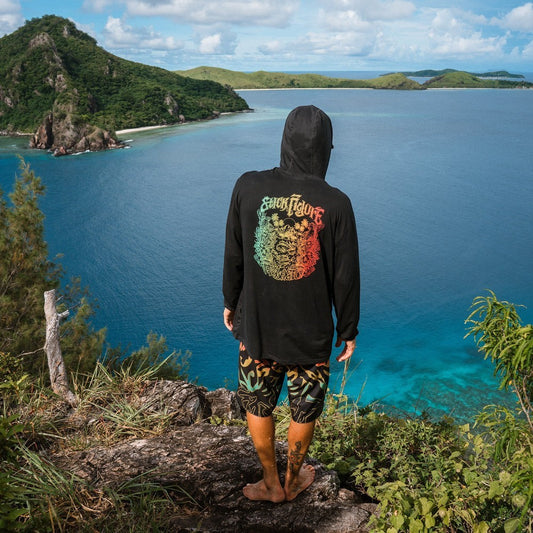 Dogfish Tackle & Marine black long-sleeve hooded shirt with colorful graphic on back, thumbholes, and kangaroo pocket.