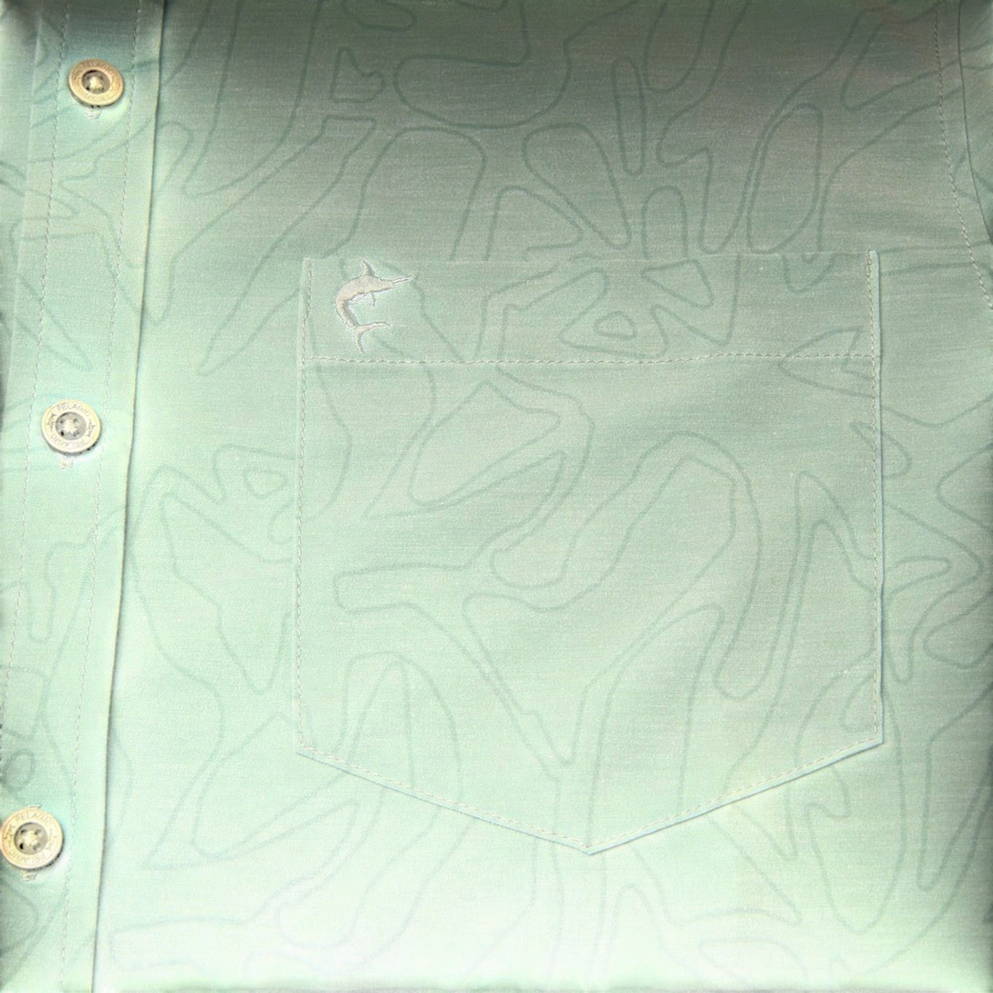 Dogfish Tackle & Marine light green button-down shirt with a subtle wave pattern and embroidered fish logo on chest pocket.