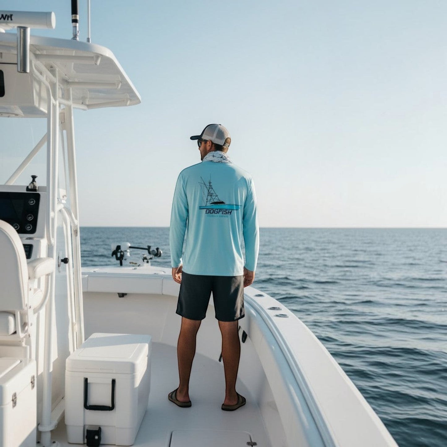 Dogfish Tackle & Marine light blue microfiber long sleeve shirt with fish logo, UPF 50+ sun protection.