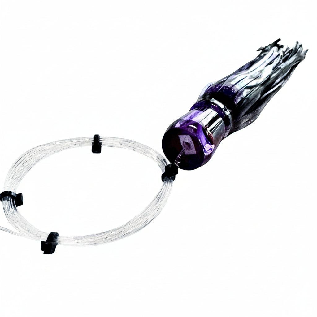 Dogfish Tackle & Marine purple and silver chugger trolling lure with monofilament leader for offshore game fishing