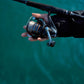 Dogfish Tackle & Marine Shimano Nexave FJ spinning reel, black with orange accents, held by a person fishing.