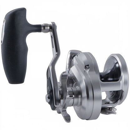 Dogfish Tackle & Marine Shimano Ocea Jigger conventional fishing reel, silver aluminum body with black handle, star drag, and long crank.