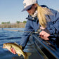 Dogfish Tackle & Marine Shimano SLX DC low profile baitcasting reel with a woman holding a bass.