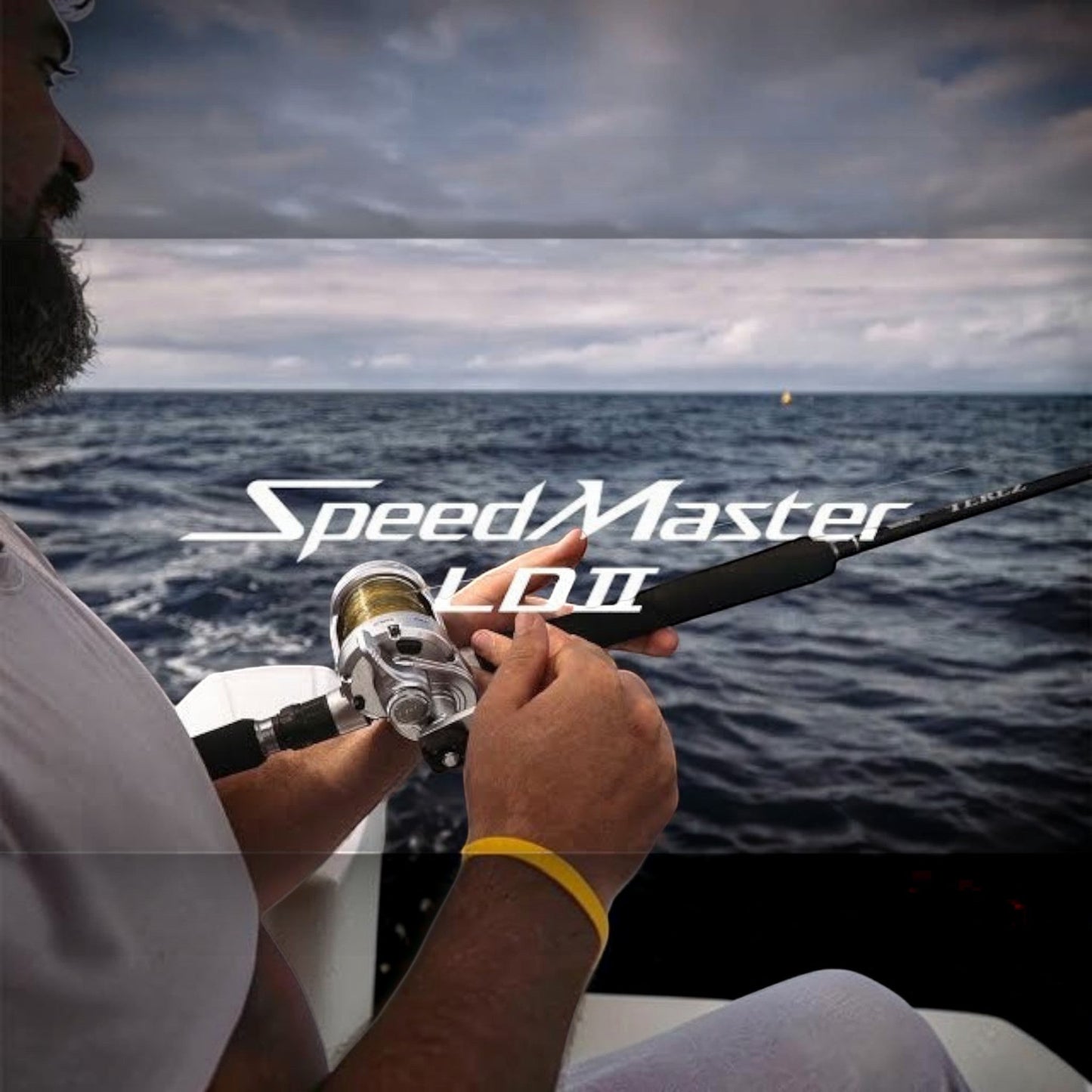 Dogfish Tackle & Marine Shimano SpeedMaster II conventional fishing reel, silver and gold, with black rod. Two-speed lever drag.