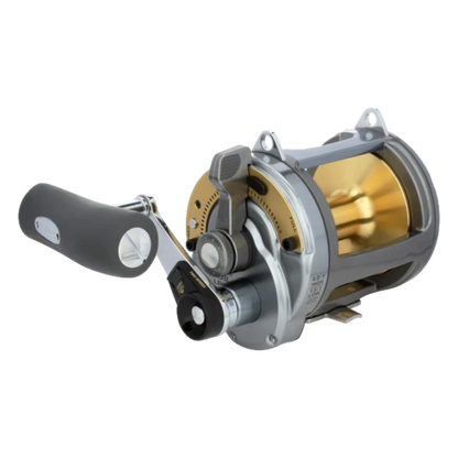 Dogfish Tackle & Marine Shimano Tyrnos 2-Speed conventional fishing reel, silver and gold, with lever drag and large handle.