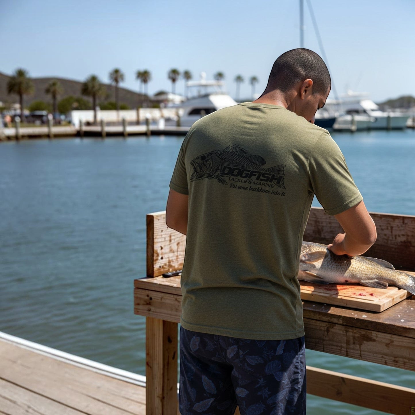 Dogfish Tackle & Marine olive green heather short sleeve t-shirt with skeleton fish graphic and tagline "Put some backbone into it."