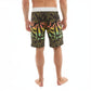 Dogfish Tackle & Marine black boardshorts with abstract yellow, pink, and green graphic print. Features a white waistband and 19in outseam.