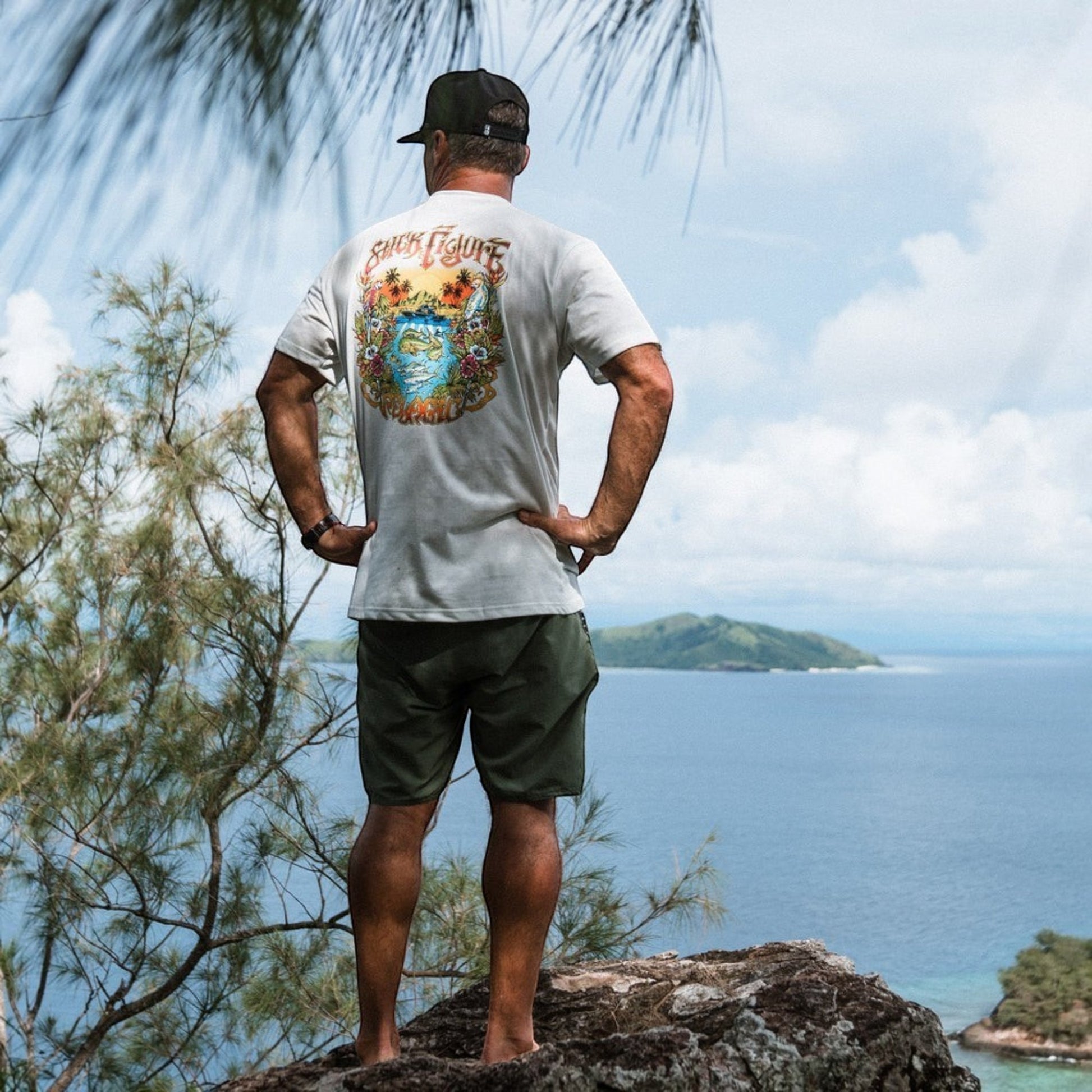 Dogfish Tackle & Marine light grey 60% cotton 40% polyester t-shirt with a colorful "Stick Figure" graphic on the back.