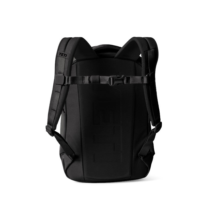 Dogfish Tackle & Marine black Yeti Ranchero 12L backpack showing the back panel, shoulder straps, and sternum strap.
