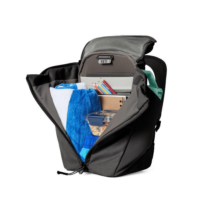 Dogfish Tackle & Marine Yeti Ranchero 12L backpack open with organized gear, tablet sleeve, and interior pockets.