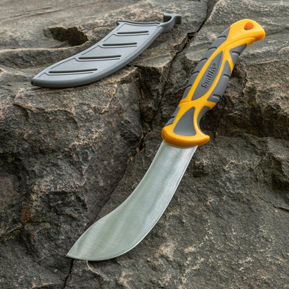 Bowie knife with a gray blade and orange handle on a rocky surface